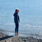 Teresa standing in the ocean