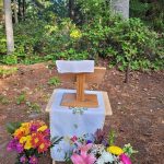 Flowers and pulpit at Wild Church
