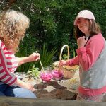 Sophie and Lyn with the collected wild rose petals