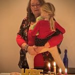 Jacqueline holding her granddaughter
